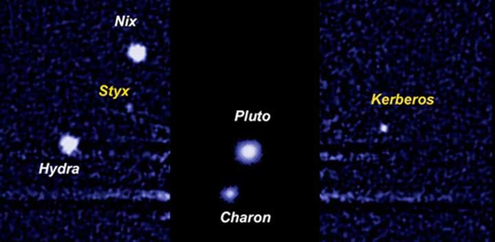 Зображення Плутона та його супутників, отримане Космічним телескопом імені Габбла.